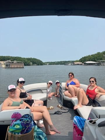 Friends boating on a rental at Lake of the Ozarks